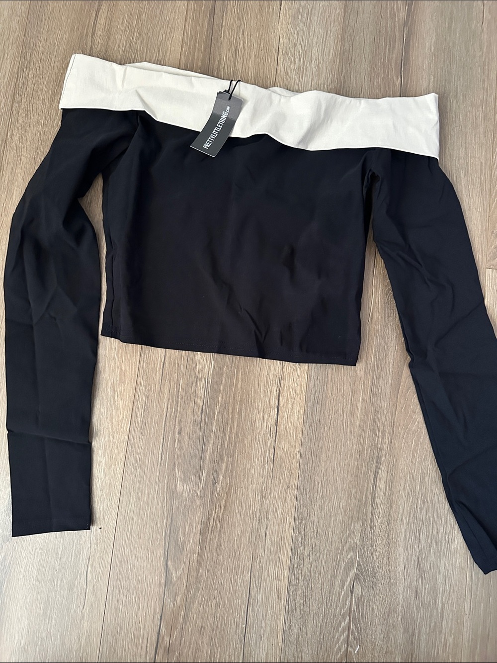 PrettyLittleThing Off-Shoulder Crop Top in Black and Cream